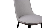 A gray upholstered dining chair with slim black matte finish steel legs.