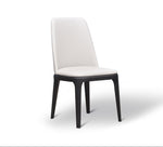 A modern white dining chair with a wooden frame and a full backrest.