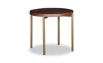 Small round table with dark top and brass legs on a white background