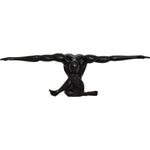 A black matte statue of a figure with arms outstretched, standing on a base, with a matte finish.