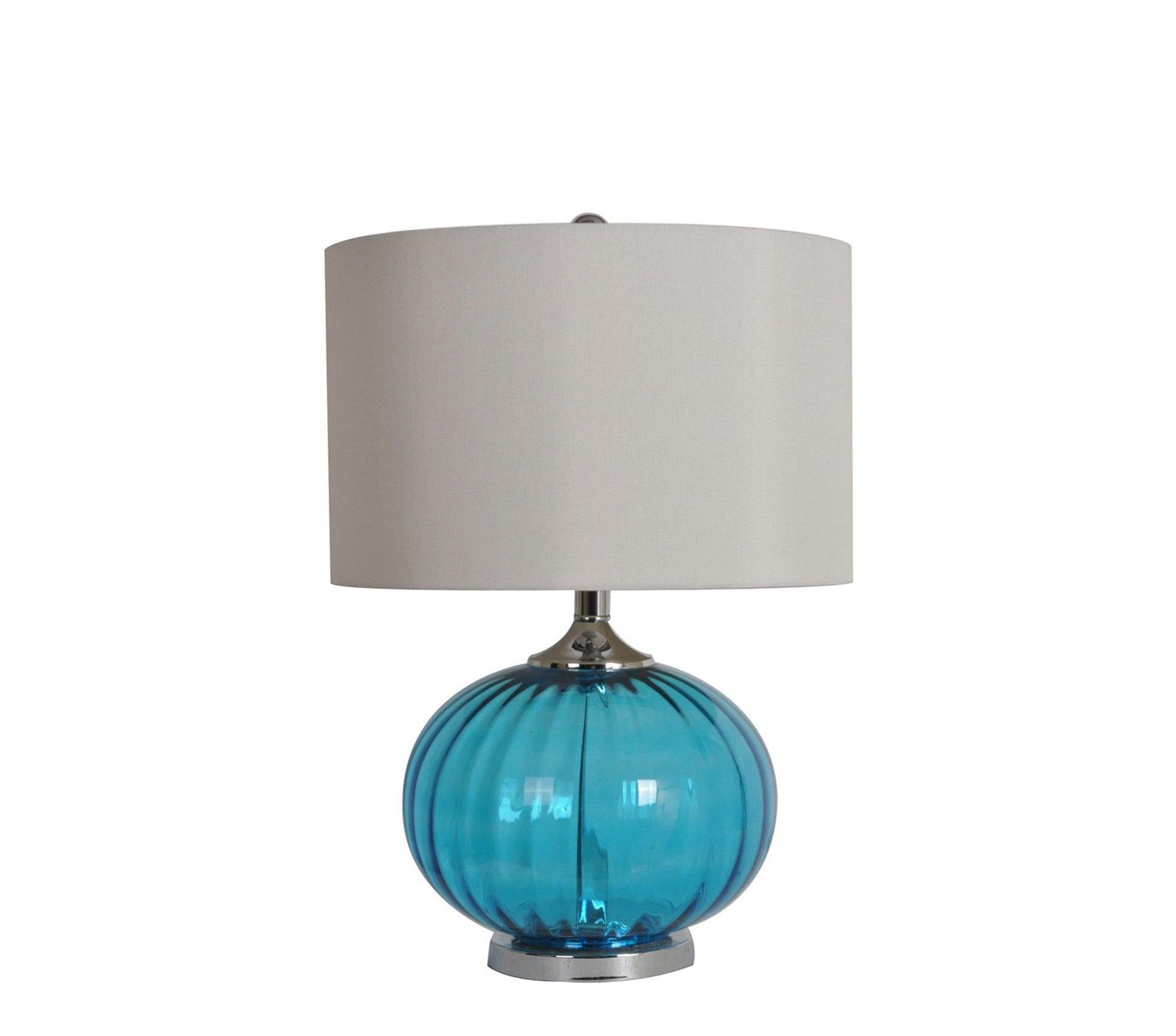 A table lamp with a seablue glass base and a white fabric shade.