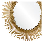 A round decorative mirror with a gold leaf finish frame designed to resemble a sunburst.