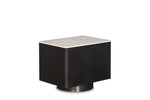 Black cube-shaped object with a white top on a white background