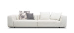 A white sectional sofa with goose down filling, featuring a minimalist design with a chrome metal frame and a photograph on the backrest.