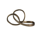 A sculpted ribbon-shaped decorative object with a brass finish.