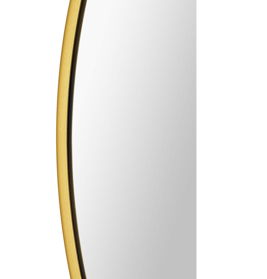 A round mirror with golde frame