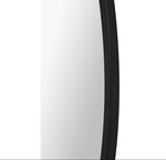 a round mirror with black frame