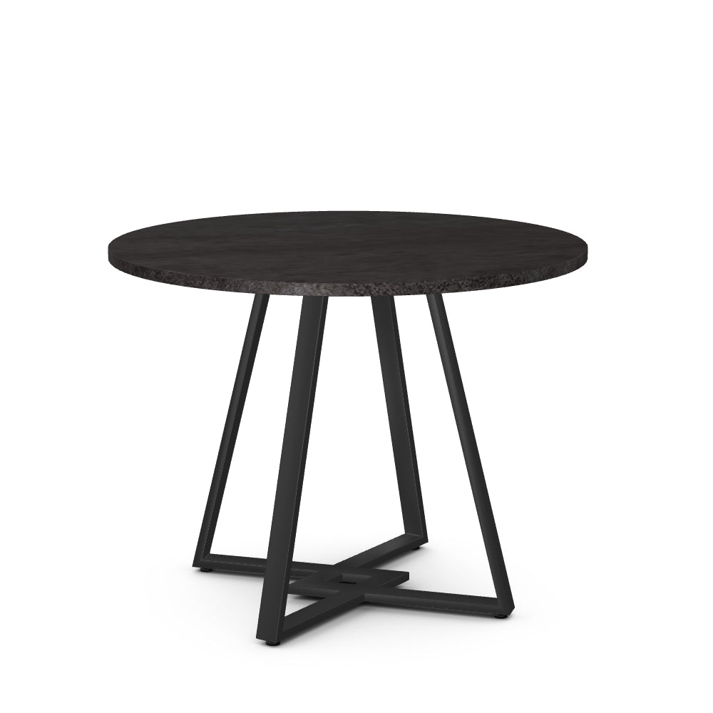 A round dining table with a black laminate top and black metal legs.