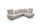 A modern beige sectional sofa with metal armrest supports and an adjustable backrest, set against a white background.