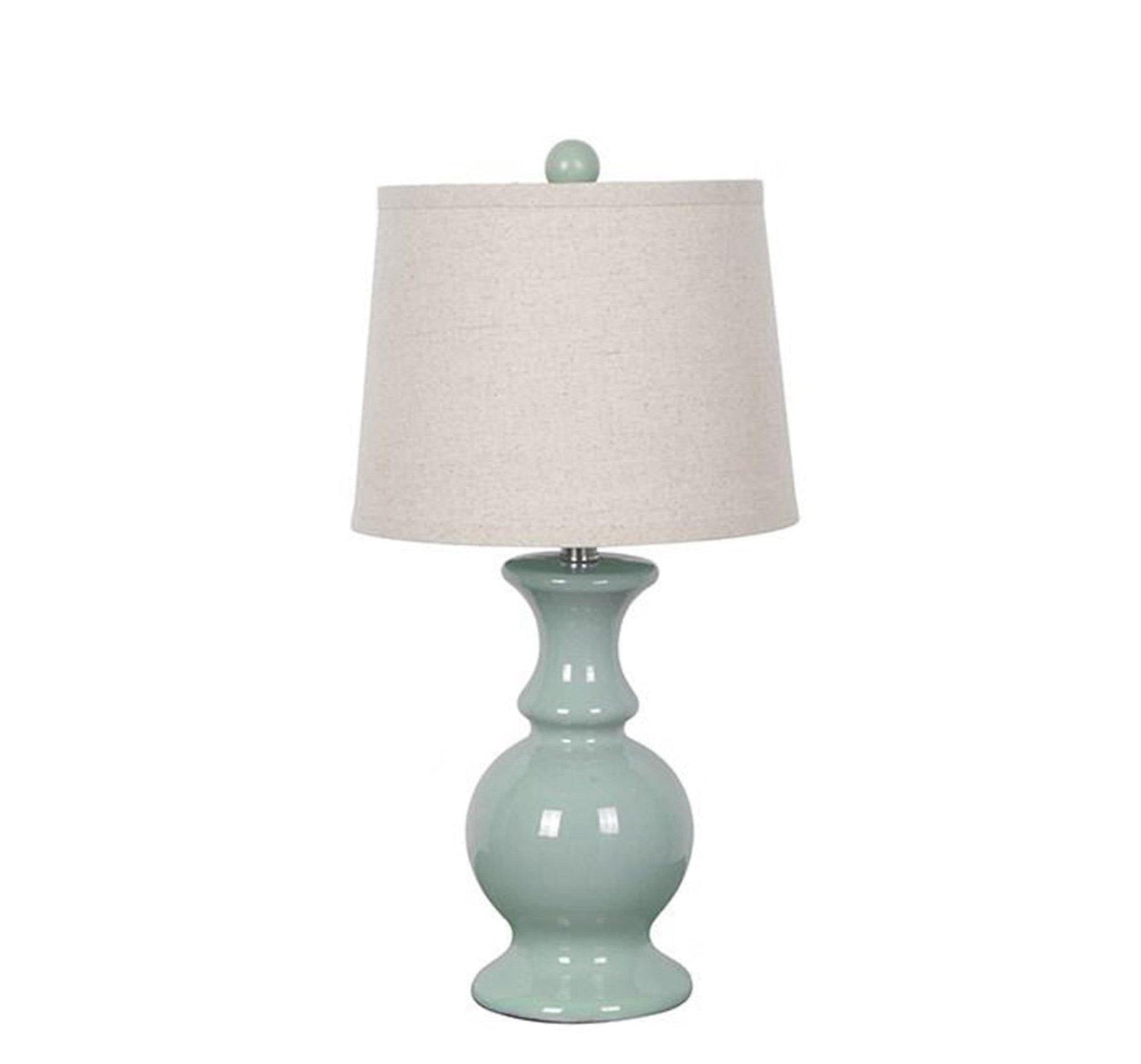 A dusty blue ceramic table lamp with a cream linen fabric shade.