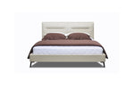 A queen-sized beige leather bed frame with a headboard, bed frame, and bed slat. The bed is set against a white background and is shown with a brown bedsheet and pillows.