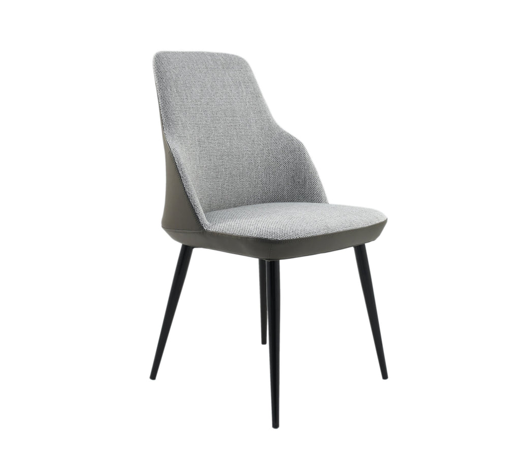 A gray Astro G dining chair with a faux leather seat and metal legs.